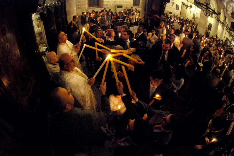 Candle burning  ceremony with the holy fire 