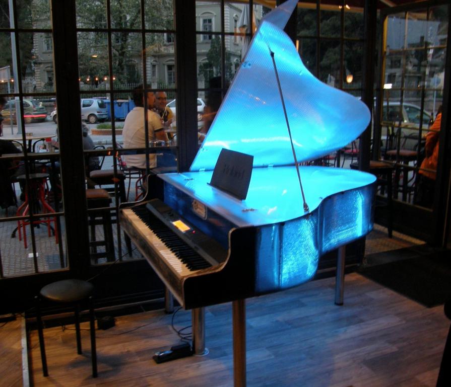 Translucent lighted stage piano 