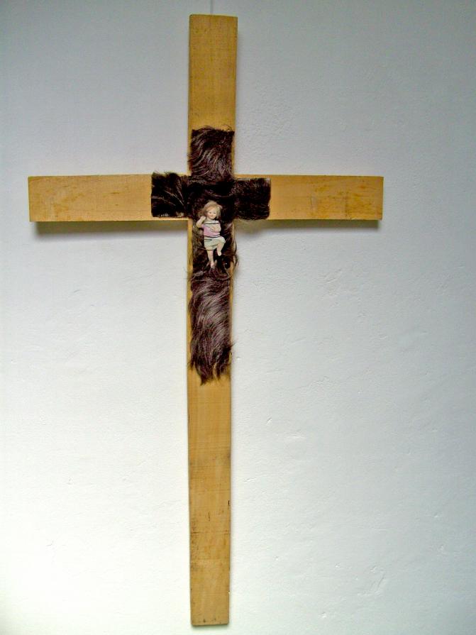 the return of little Jesus on a cross of human hair 