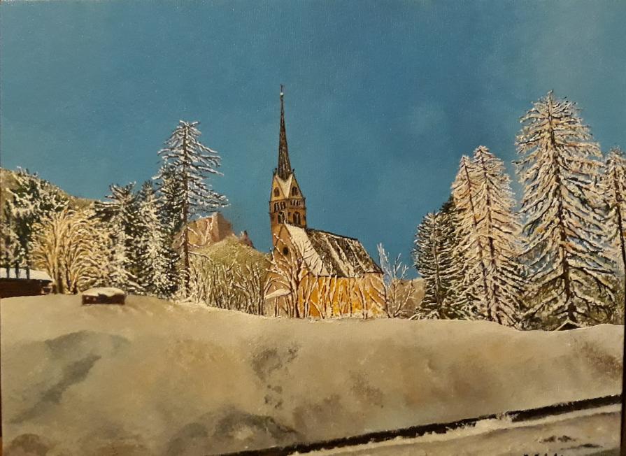 Chiesa di S.GIovanni a Pozza di Fassa,  la montagna innevata.